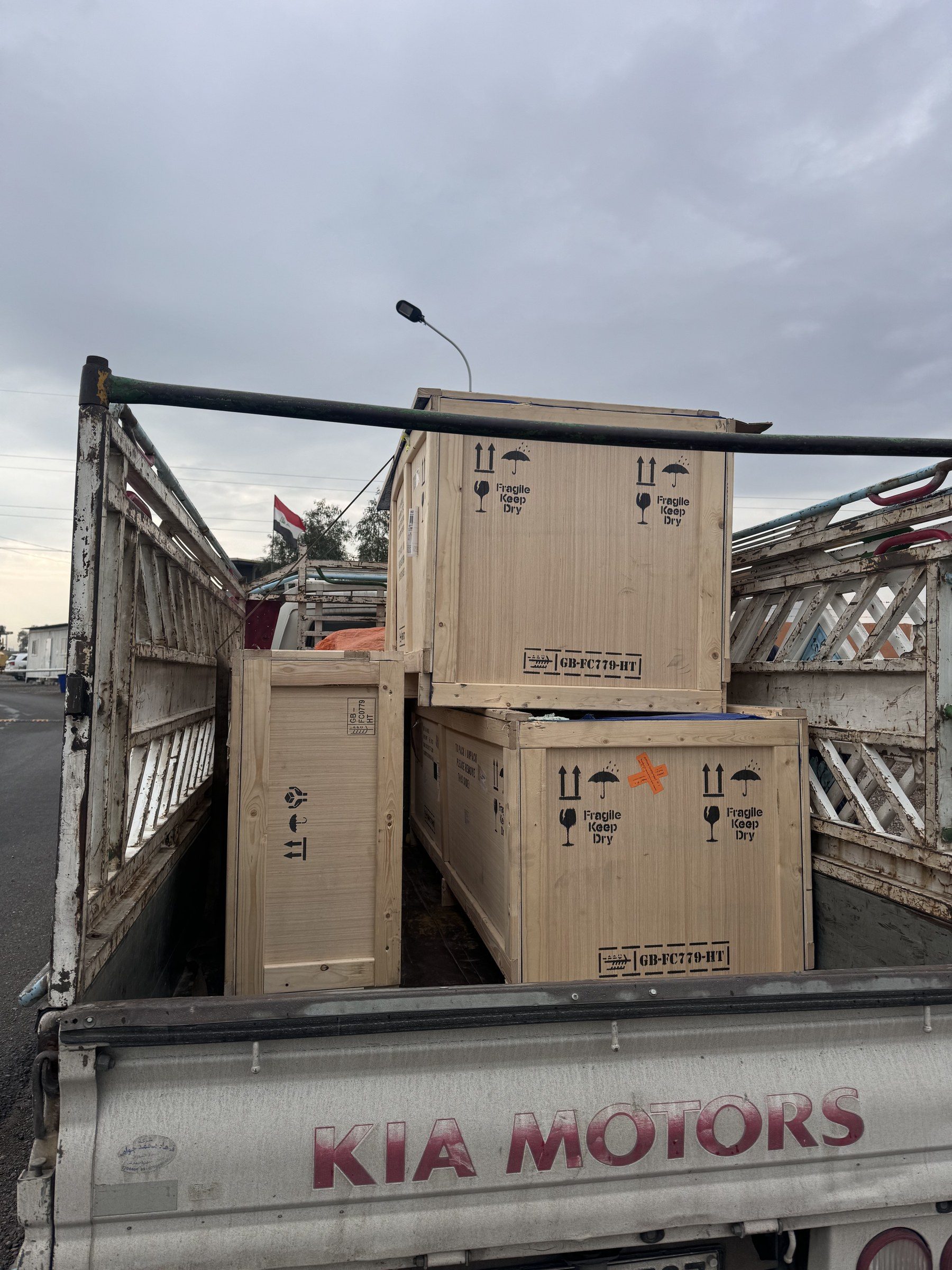 Wooden export crates holding the CalBench, loaded on a truck.