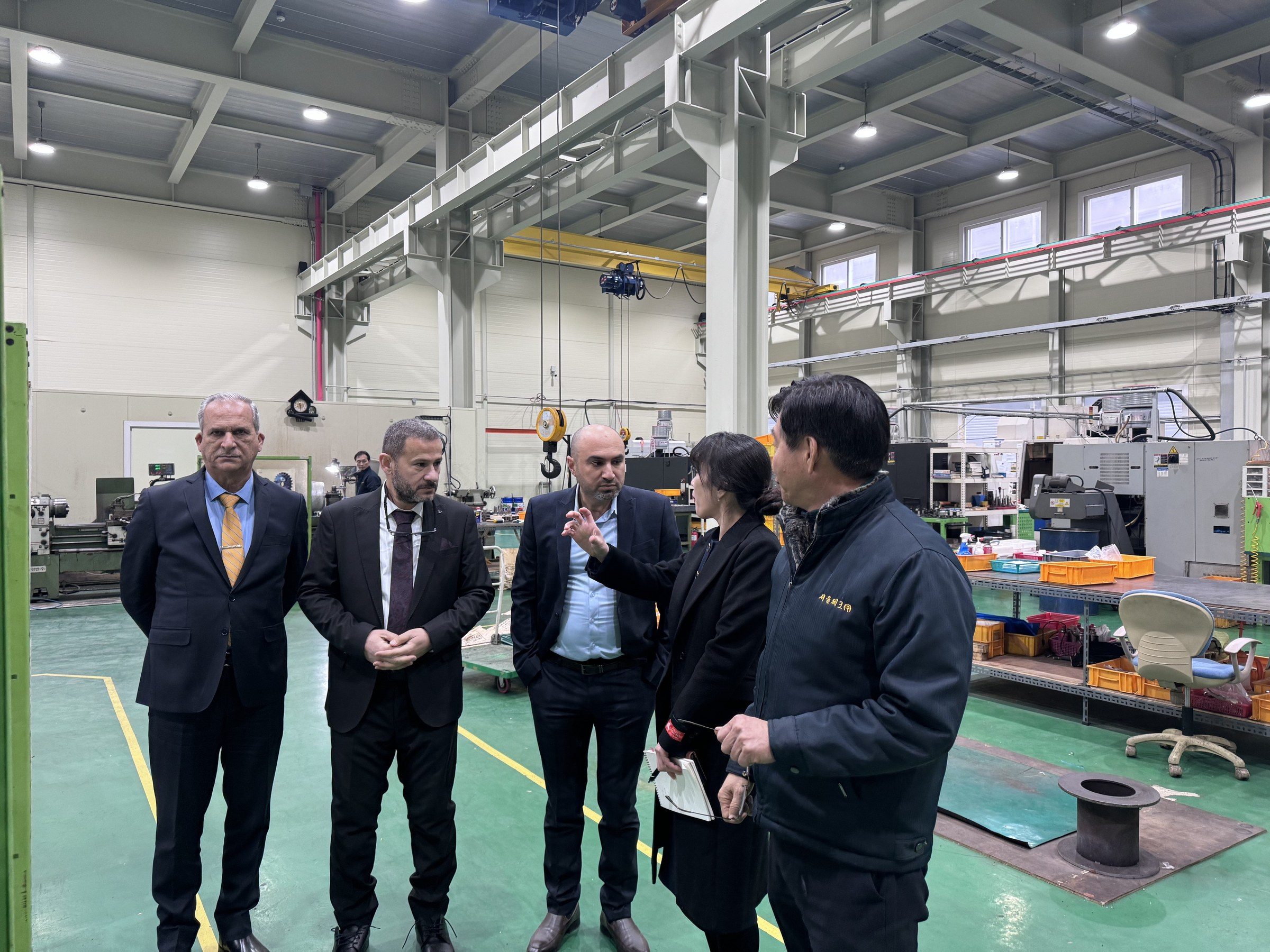 The delegation on the Seoul Tech machining shop floor.